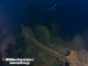 Accommodation decks. The funnel and ventilators. Lots of marine growth and fishing net.